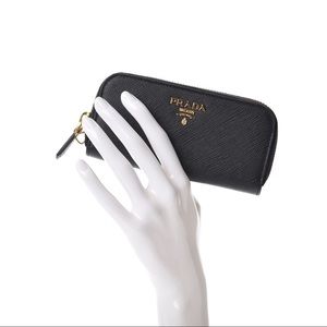 Prada Saffiano Metal Zip Around Key holder in like new condition.